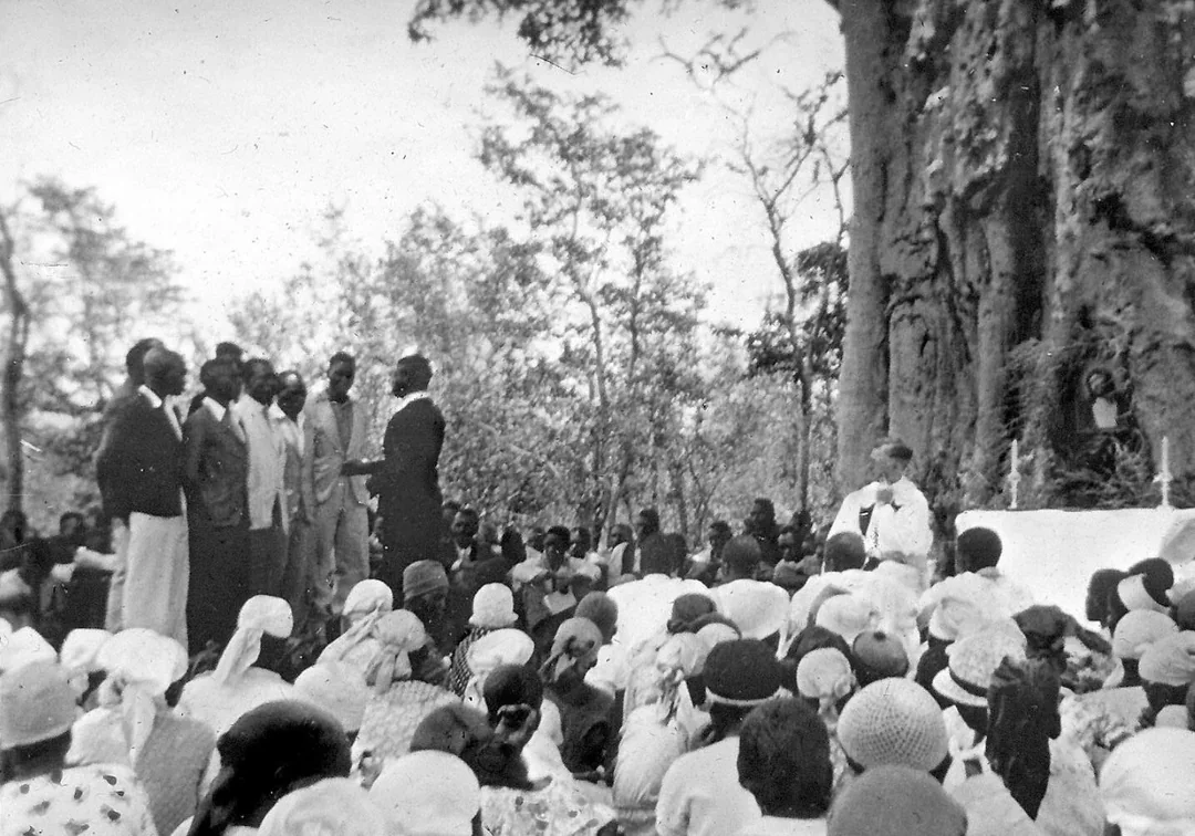 Historic photograph of a service at Manama Baobab